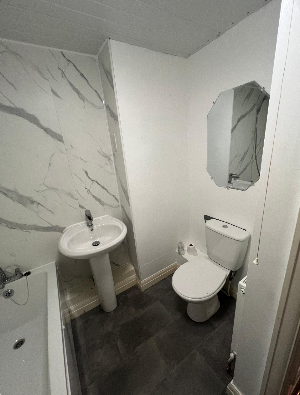 Bathroom transformation with modern fixtures and tiling